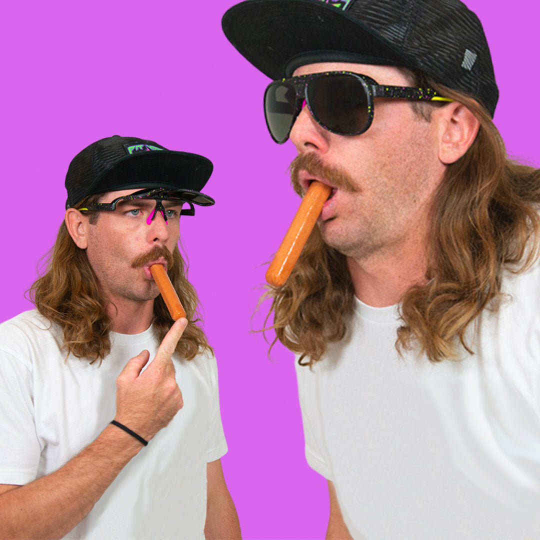 / Smoke | Man with a hotdog in his mouth wearing Pit Viper Sunglasses
