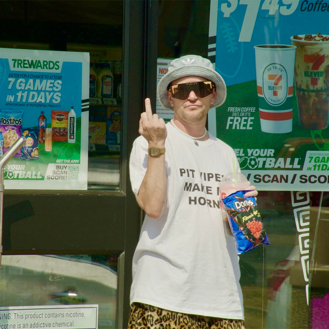 / Smoke | A man flipping off the camera wearing Pit Viper Sunglasses