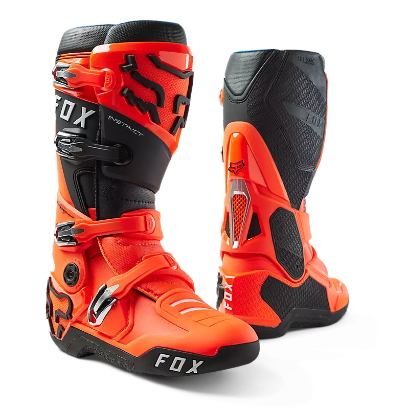 Vibrant Flo Orange Instinct Boots on a White Background