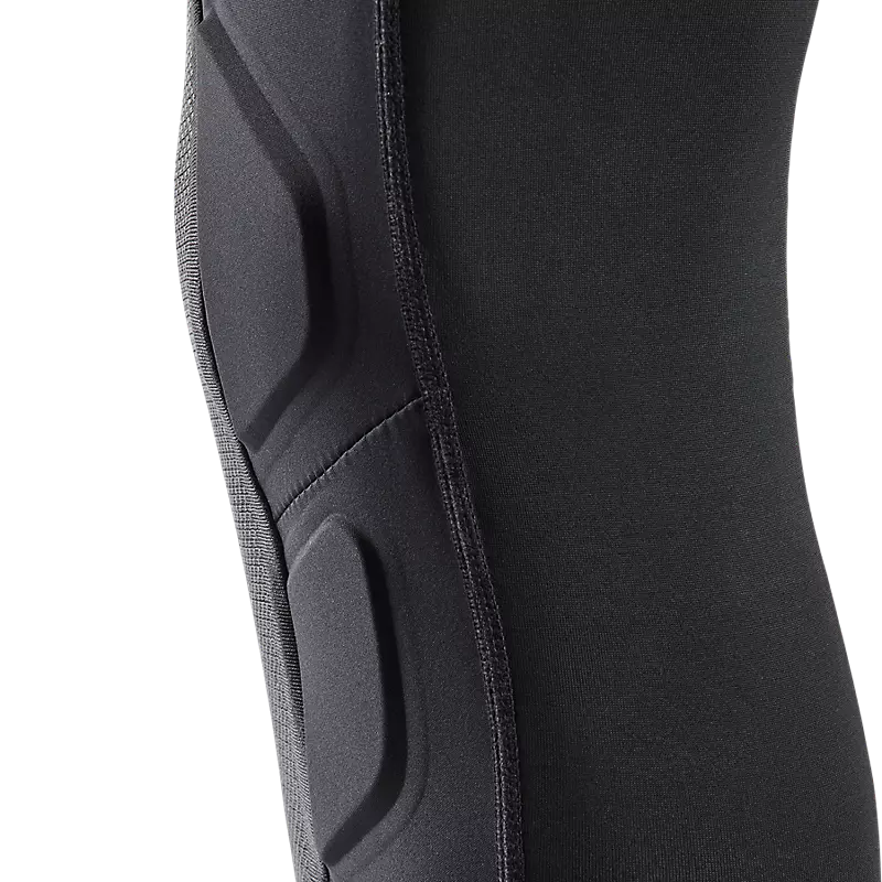 LAUNCH ELITE KNEE/SHIN GUARD in black and orange with a sleek design, showcasing reinforced padding for maximum protection during sports activities.