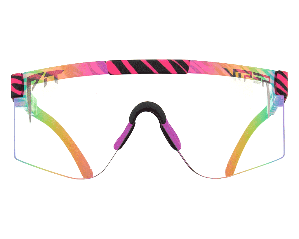 Woman wearing The Hot Tropics Photochromic 2000s sunglasses, color-changing in sunlight
