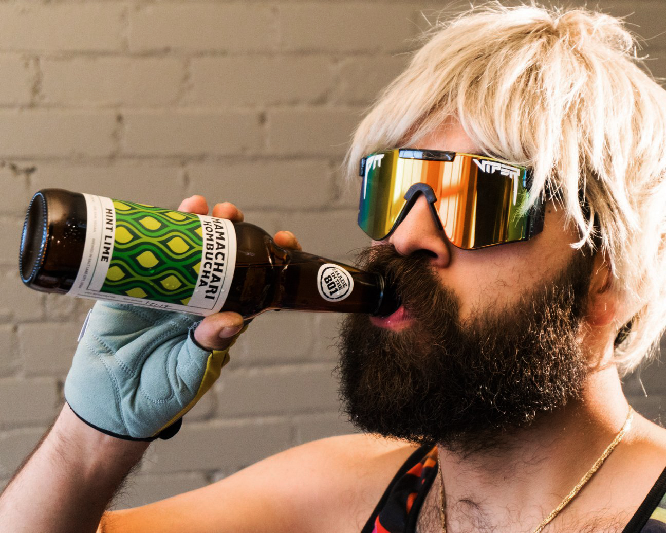 Lifestyle - man drinking wearing wig