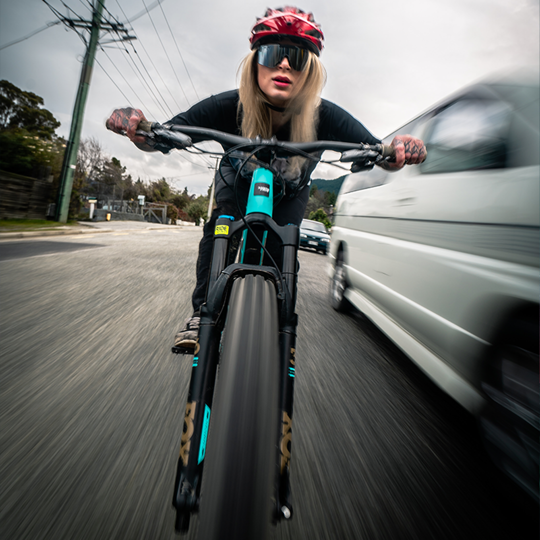 / BALL-ISTIC™ Smoke | Woman mountain biking wearing Pit Viper Sunglasses