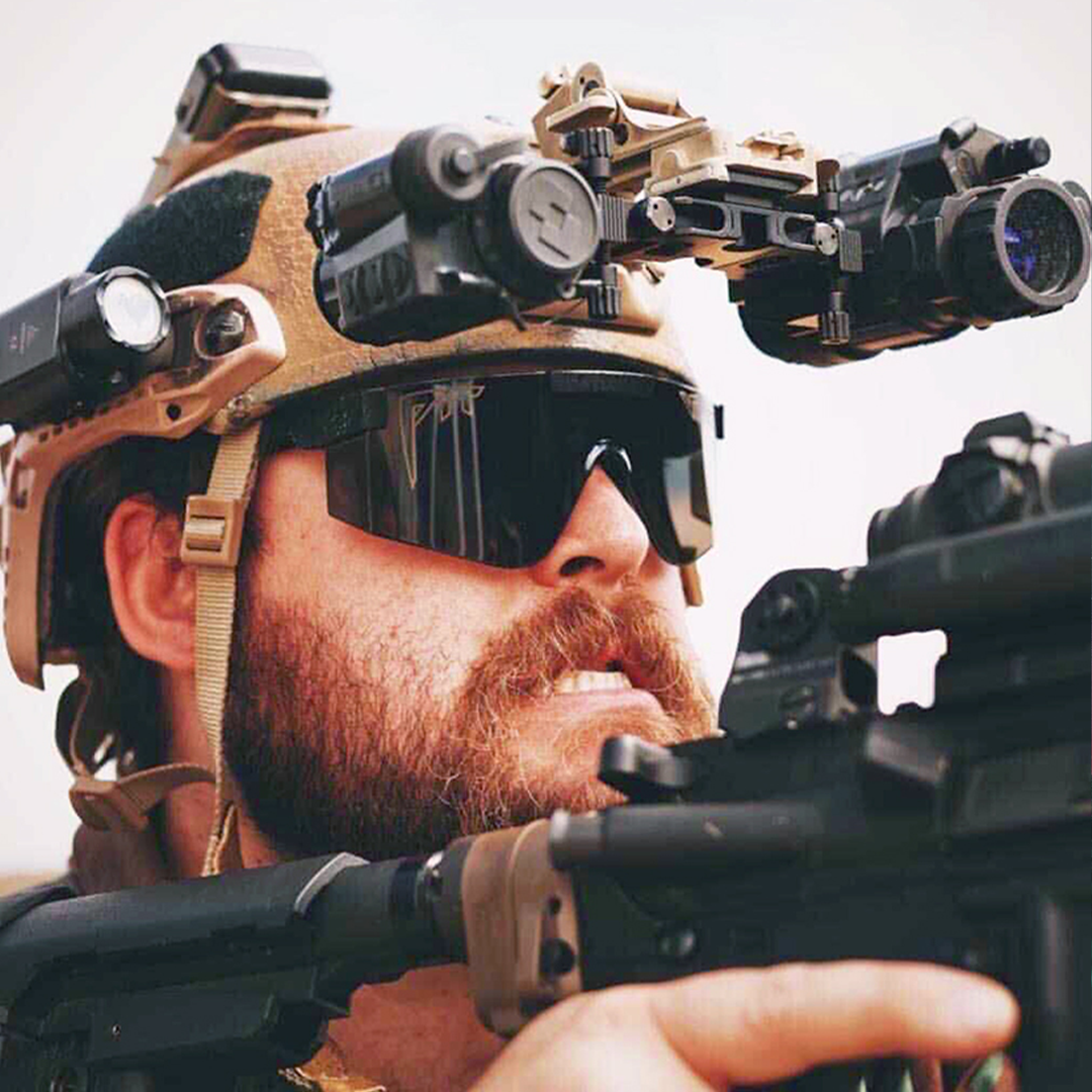/ BALL-ISTIC™ Smoke | Man shooting a gun wearing Pit Viper Sunglasses