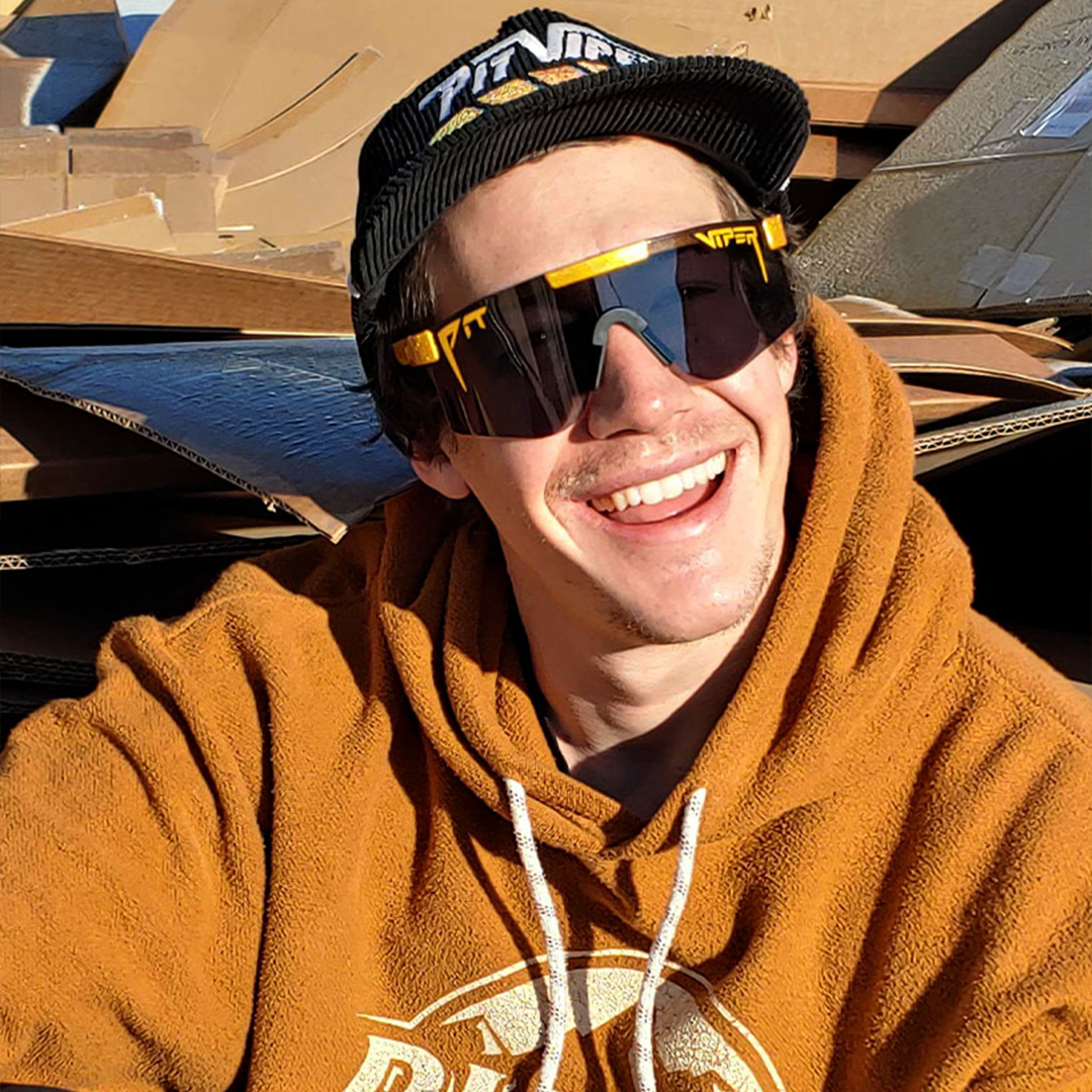 Wide / Polarized Smoke | Man smiling wearing The Kumquat Original from Pit Viper Sunglasses