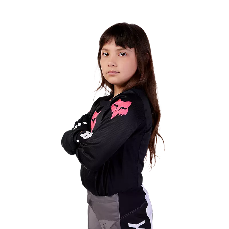 YTH Girls Blackout Jersey displayed on a mannequin, featuring a sleek black design with a comfortable fit.