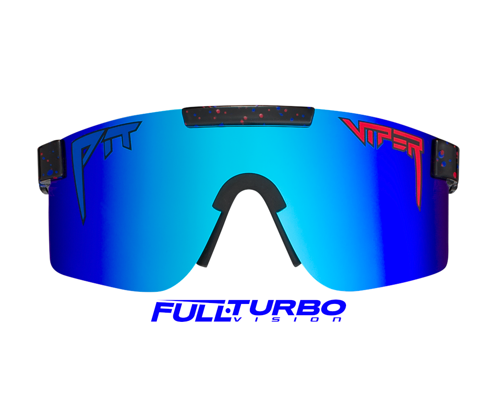 Stylish person wearing The Absolute Liberty Polarized sunglasses with a clear blue sky background