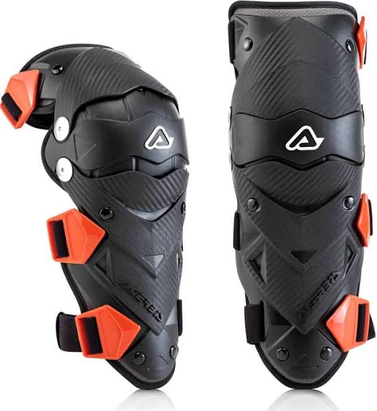 Youth wearing Acerbis Impact Evo 3.0 knee guards in black and red