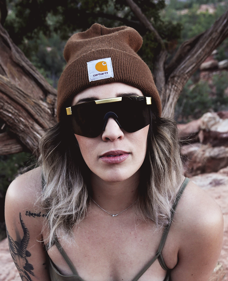 Narrow / Polarized Gold | Woman posing wearing The Money Counter Original from Pit Viper Sunglasses
