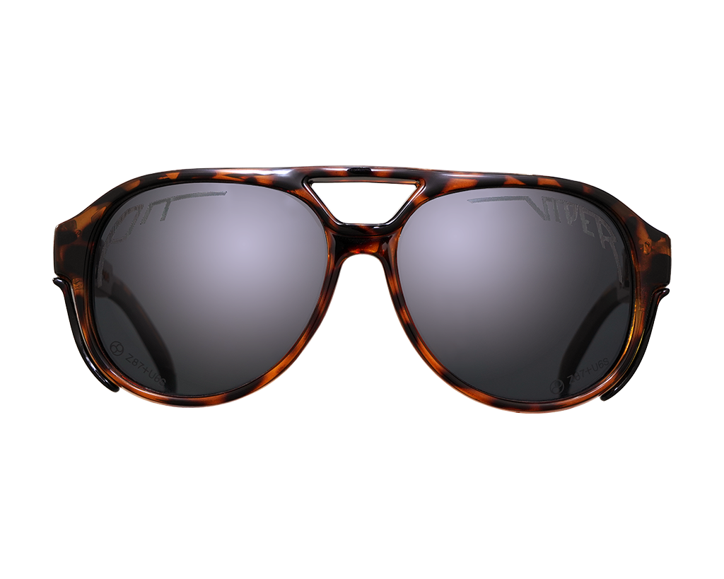 Man wearing The Land Locked Polarized Exciters sunglasses with reflective lenses in bright sunlight