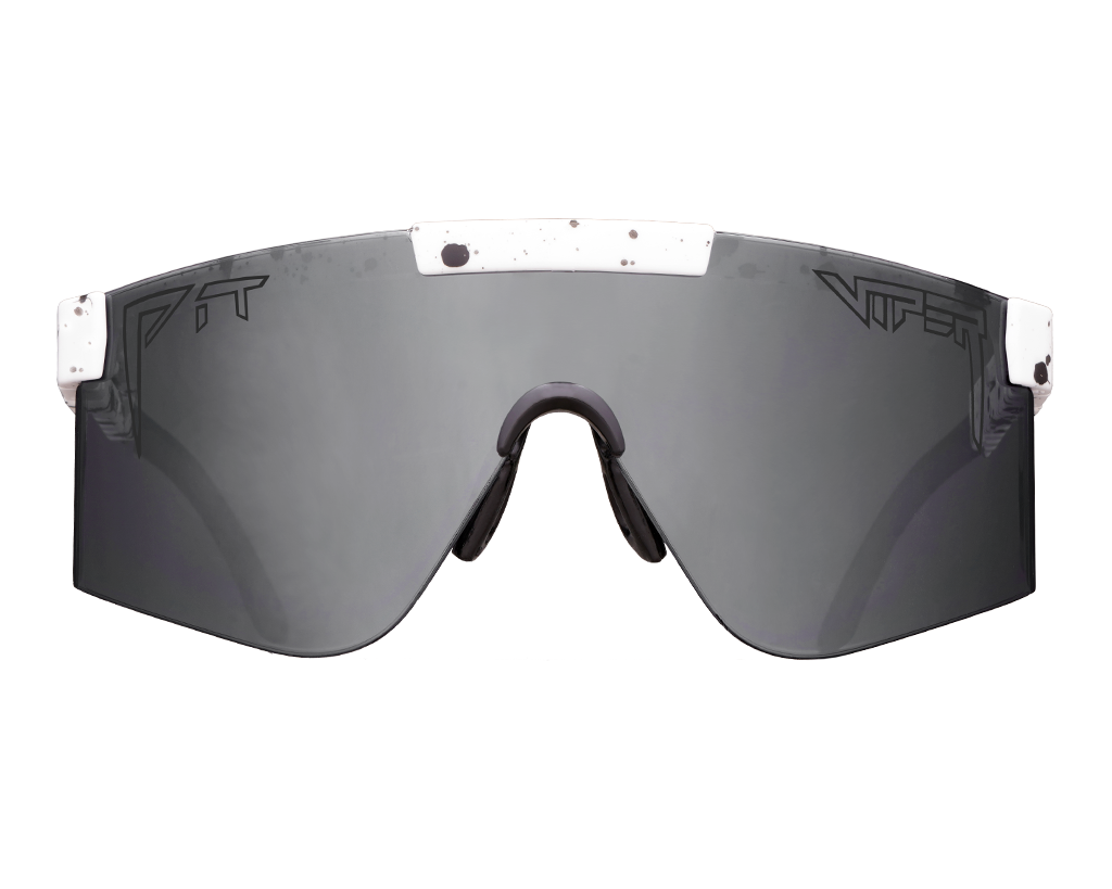 White Out 2000s high-performance snowboard with sleek design on snowy mountain background