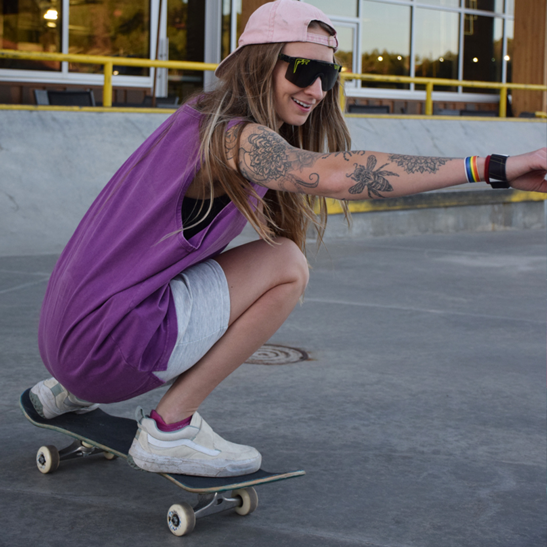 Narrow / Smoke | Woman skateboarding wearing The Cosmos Original from Pit Viper Sunglasses
