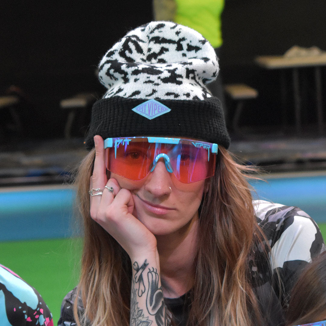 / Z87+ Climax | Woman smiling with her middle finger raised wearing Pit Viper Sunglasses
