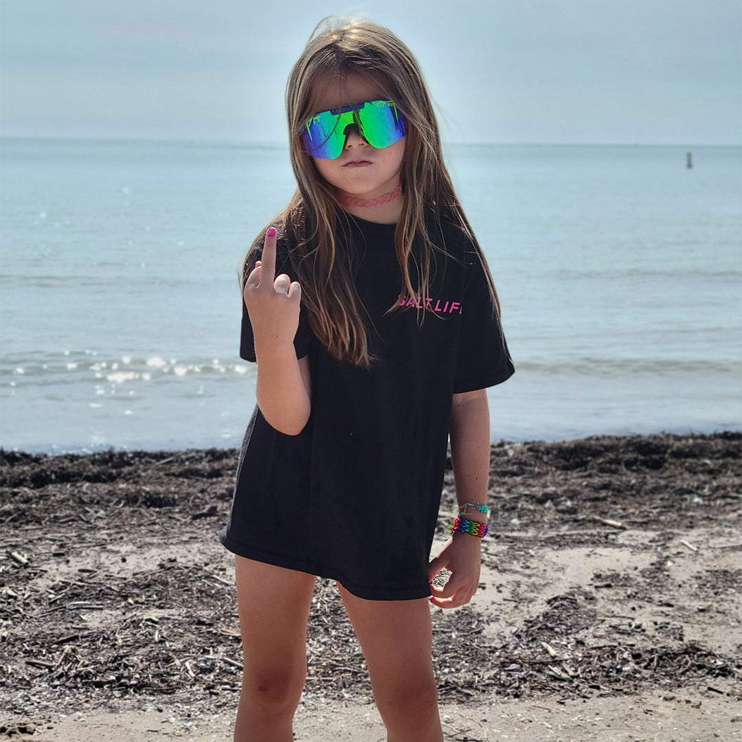 / Z87+ Blue-Green | Kid flipping off the camera on a beach wearing Pit Viper Sunglasses