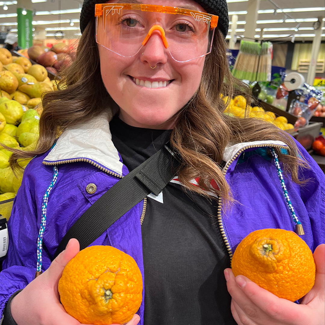 / BALL-ISTIC‚Ñ¢ Clear | Woman holding oranges wearing Pit Viper Sunglasses
