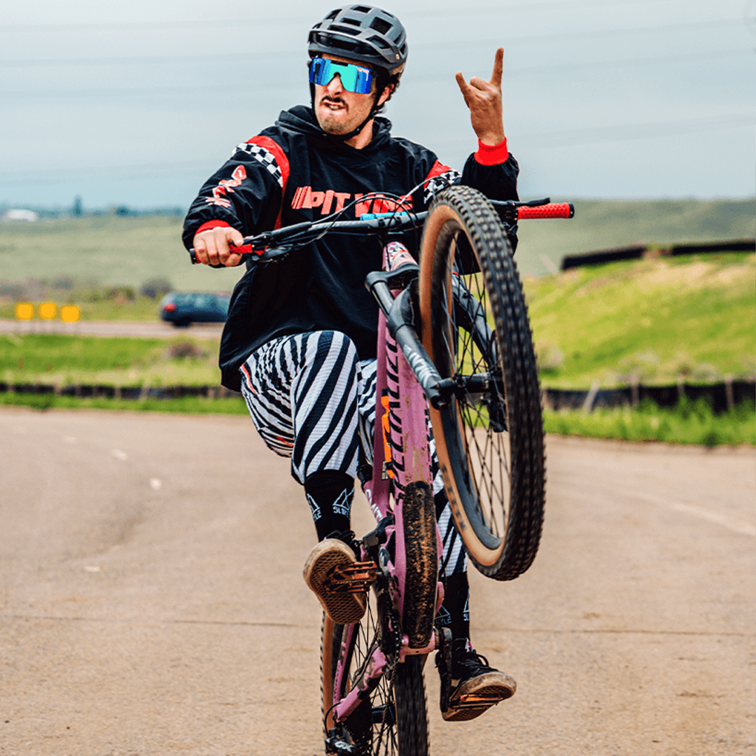 / Z87+ Blue | Man posing on a mountain bike wearing Pit Viper Sunglasses