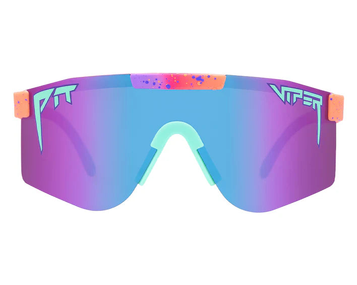 The Copacabana Polarized Double Wide sunglasses on a reflective surface showing lens clarity and frame width.