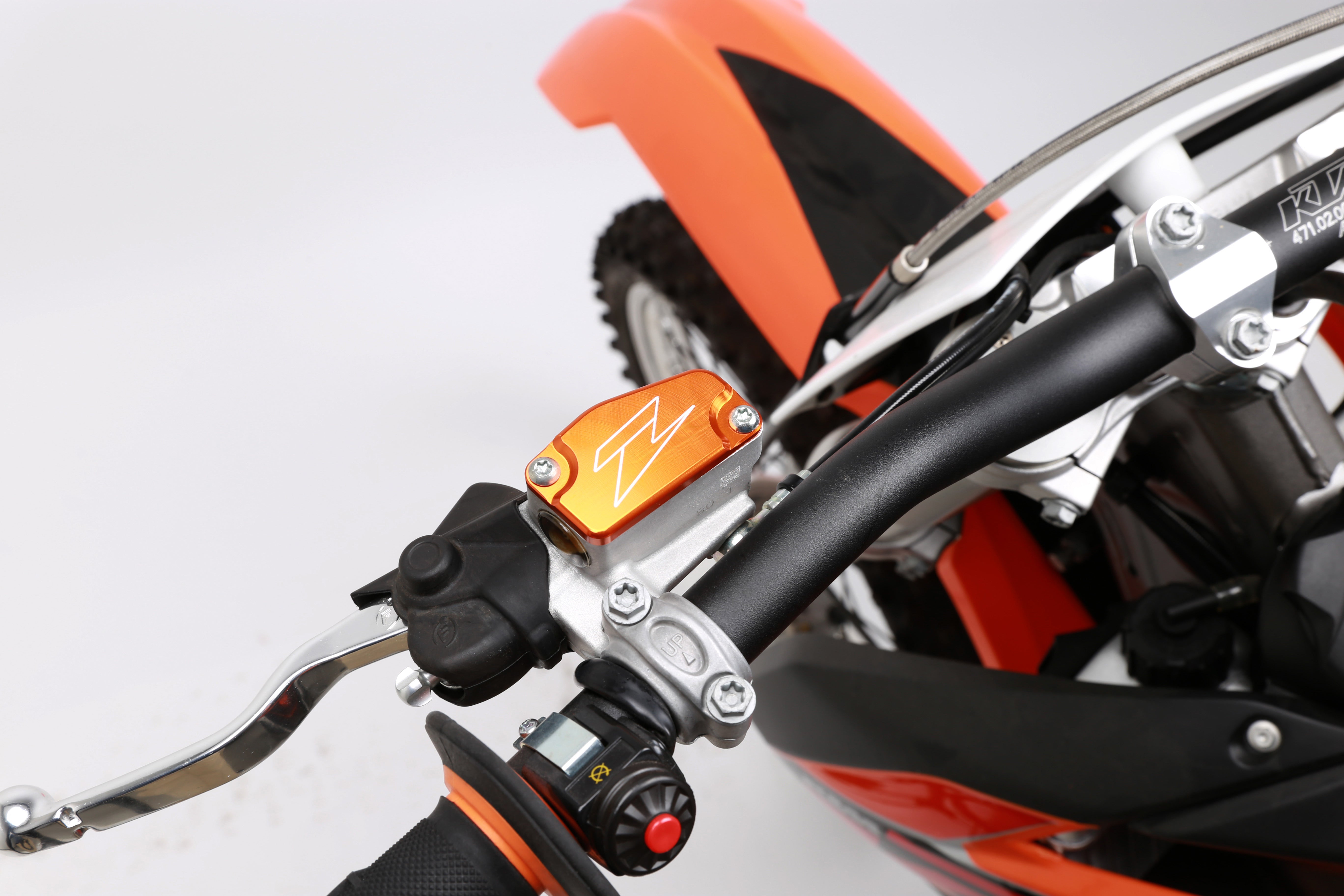 Front brake reservoir cover for KTM SX65/85 models from 2014 to 2020, showcasing its sleek design and durable material.