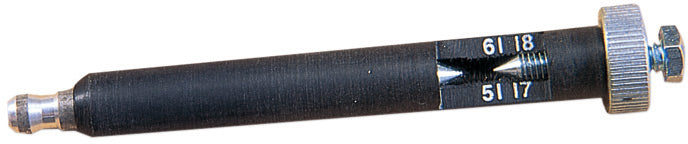 Ignition system tester with a digital display and diagnostic connectors on a white background.