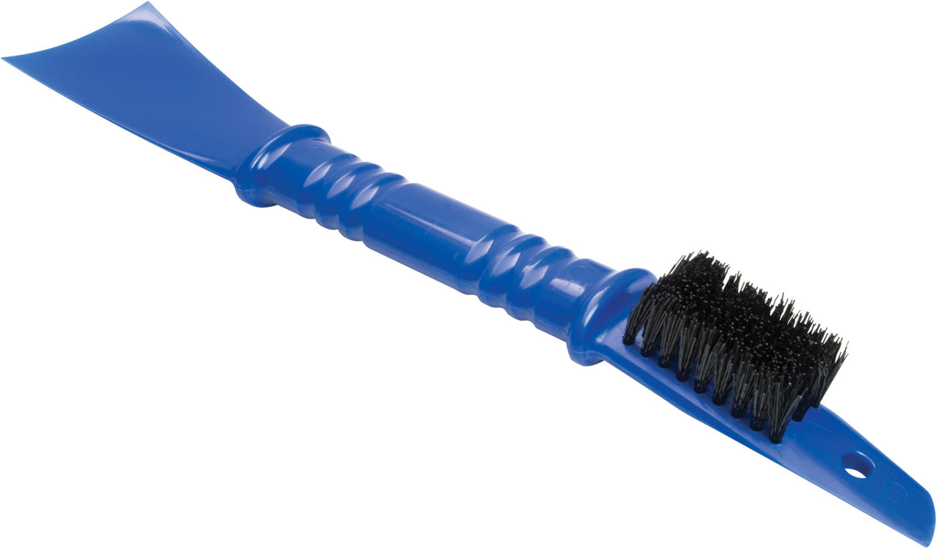 Motospade cleaning brush and scoop in use, showing its effectiveness in dirt removal