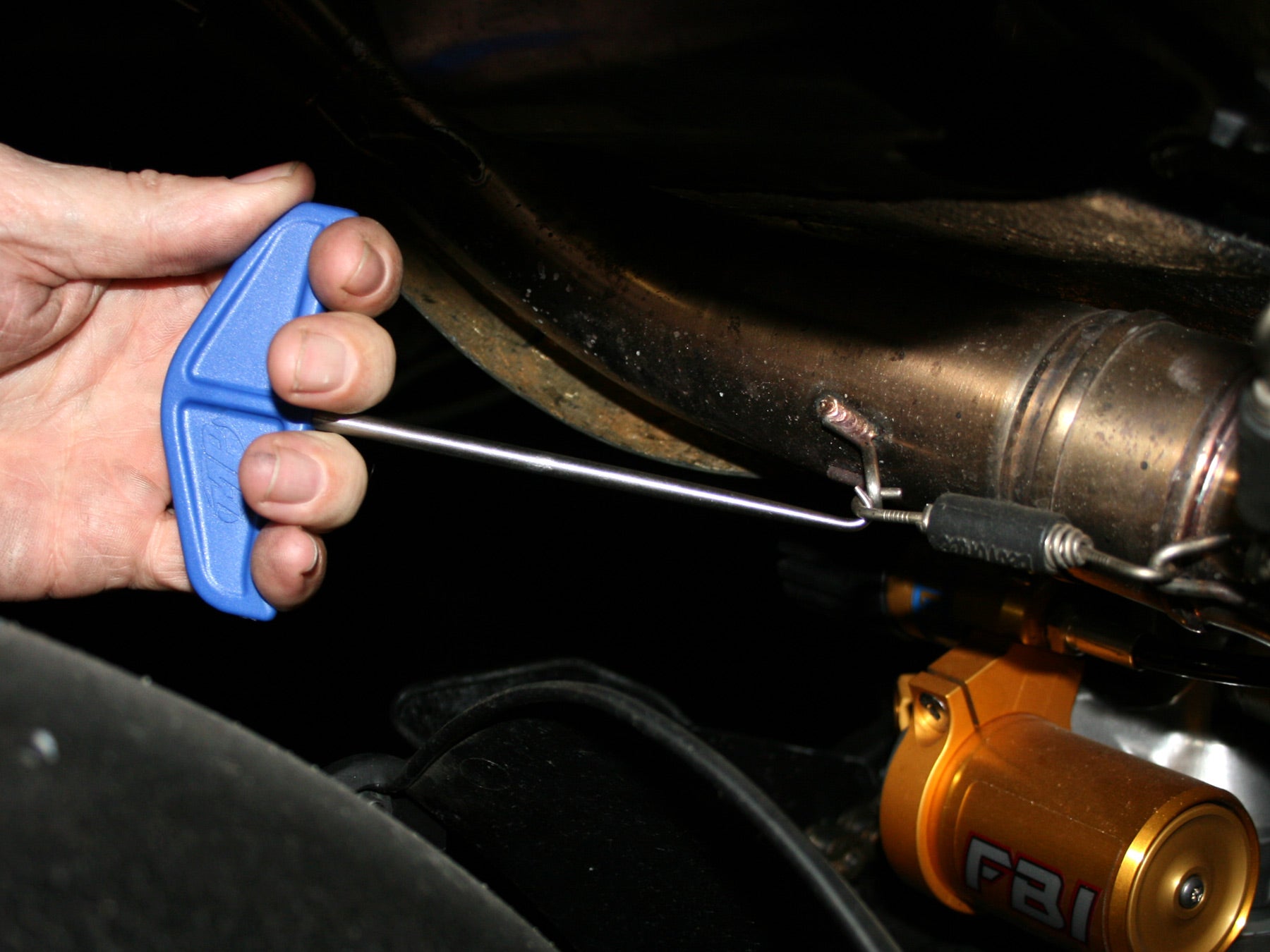 Mini spring hook with ergonomic handle design for comfortable grip and efficient use.