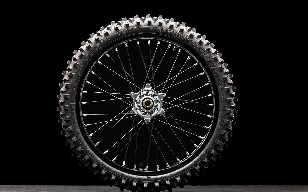 Front wheel assembly with tire for bicycles, showing wheel, tire, and spokes on a white background.