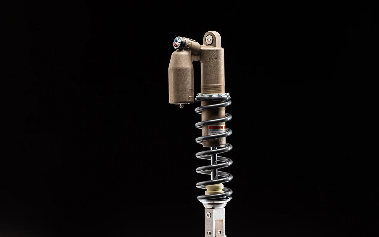 KYB Rear shock for 80 to 85 kg or 176 to 187 lbs, showcasing the shock absorber's design and features